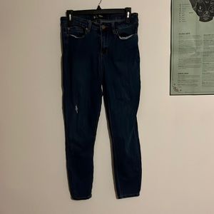 straight leg blue jeans with small rip